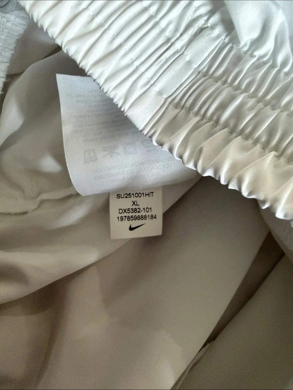 Nike Kids White Athletic Shorts with Black Swoosh Logo